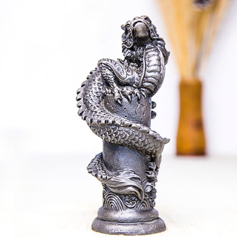 Flying Dragon Pillar Resin Statue – three-quarter view with vase and dried stems in background, fortune accent