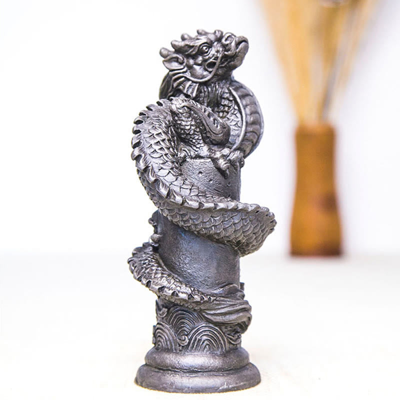 Flying Dragon Pillar Resin Statue – three-quarter side with warm amber bokeh, spiral dragon, powerful accent
