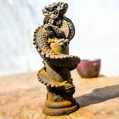 Flying Dragon Pillar Resin Statue – warm sunlight three-quarter view on rustic wood with ceramic bowl, powerful decor
