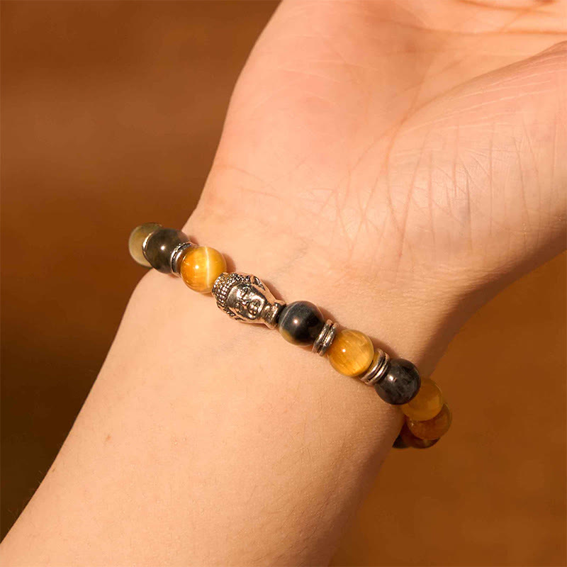 Blue Green Red Tiger Eye Buddha Bracelet – Hand making fist showing bracelet, strength symbolism