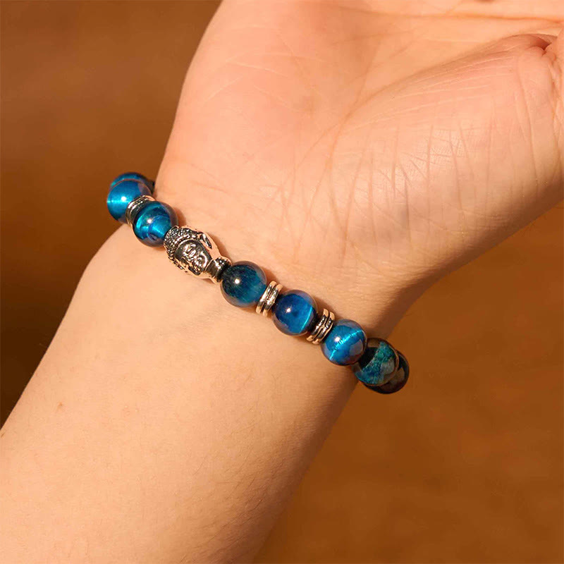 Blue Tiger Eye Buddha Bracelet – hand model showing blue bead shimmer, elegant wear
