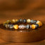 Blue Green Red Tiger Eye Buddha Bracelet – Velvet tray display in jewelry store, premium presentation