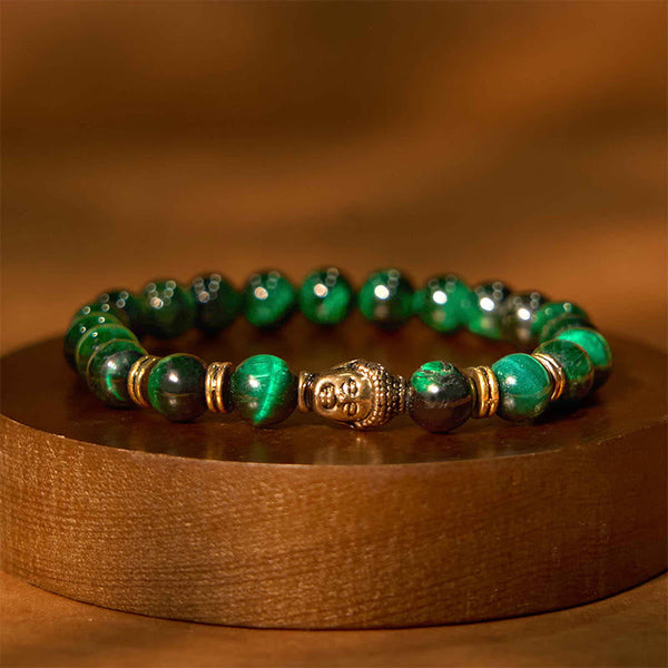 Green Tiger Eye Buddha Bracelet – marble overhead shot, minimalist product photography