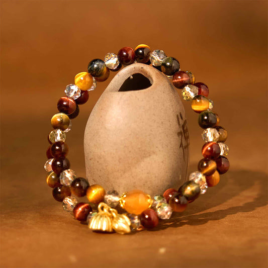 Colorful Tiger Eye Lotus Multi-Circle Bracelet - tiger eye beads draped over ceramic jug, Grounding