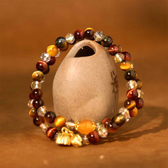 Colorful Tiger Eye Lotus Multi-Circle Bracelet - tiger eye beads draped over ceramic jug, Grounding