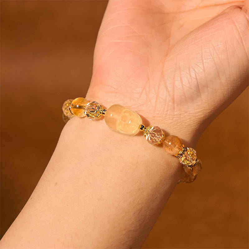 Natural Citrine PiXiu Bracelet – worn on wrist warm brown background gold accents, joy crystal jewelry