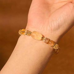 Natural Citrine PiXiu Bracelet – worn on wrist warm brown background gold accents, joy crystal jewelry