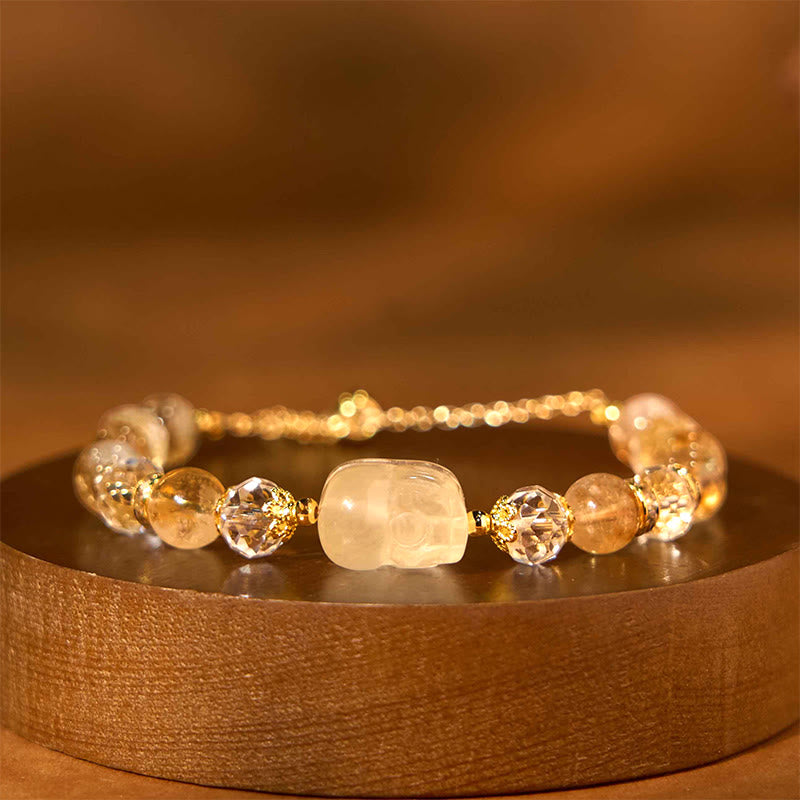 Natural Citrine PiXiu Bracelet – closeup on dark brown wood side view PiXiu beads, prosperity bracelet