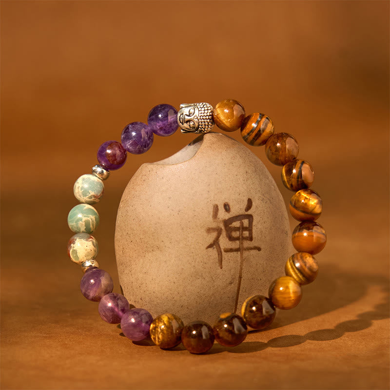Mixed Gemstone Buddha Head Bracelet – bracelet beside green plant leaf, natural wellness aesthetic composition