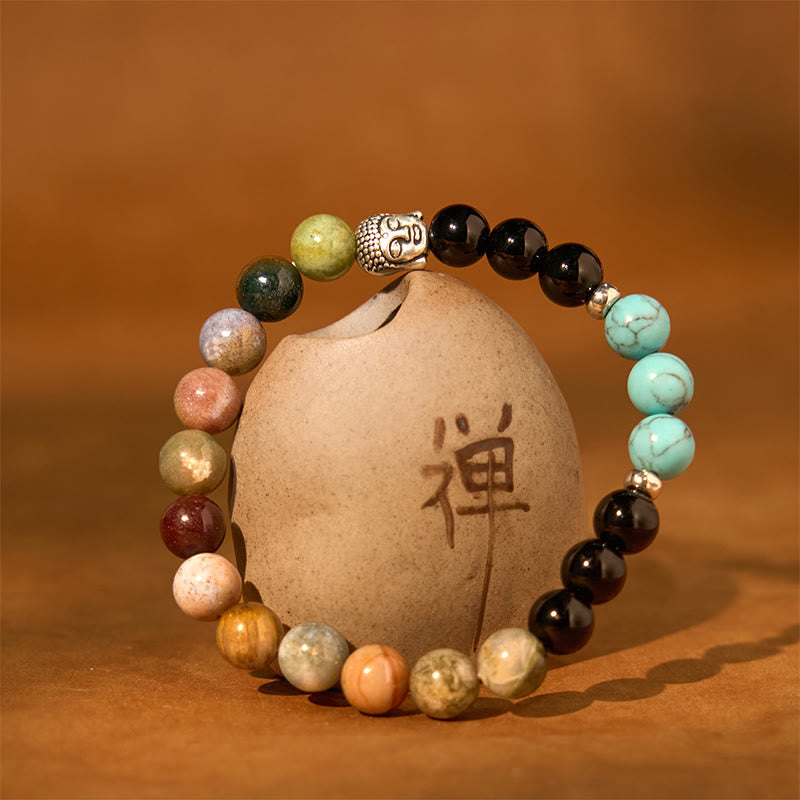 Mixed Gemstone Buddha Head Bracelet – black onyx and white howlite pair on marble surface, yin yang contrast