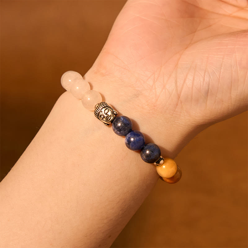 Mixed Gemstone Buddha Head Bracelet – five color variations arranged in fan shape, gemstone chakra collection display