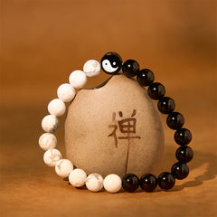 Obsidian White Turquoise Yin Yang Bracelet - beaded yin-yang bracelet on Zen ceramic vessel with calligraphy, obsidian and...