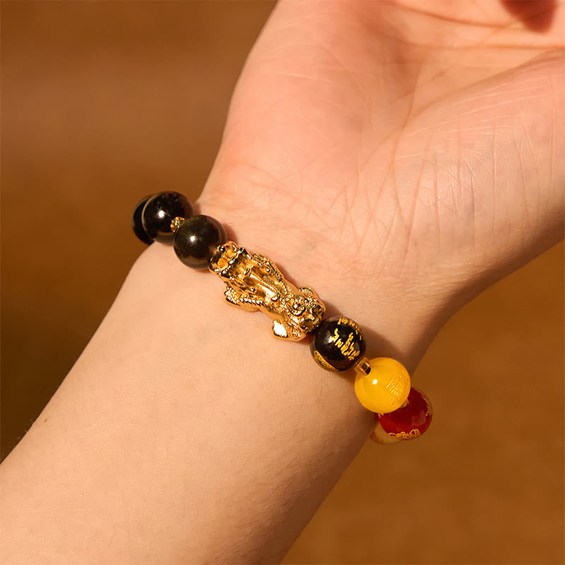 Gold Sheen Obsidian PiXiu Bracelet – worn on wrist with gold PiXiu, warm lighting, five directions gods bead