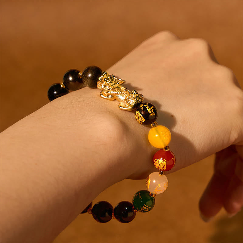 Gold Sheen Obsidian PiXiu Five Directions Gods of Wealth Bracelet – Alternate wrist view with manicured hand, five directions bracelet