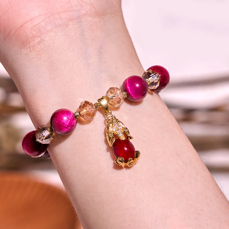 Red Tiger Eye PiXiu Bracelet – Wrist model with warm interior background, red tiger eye protection