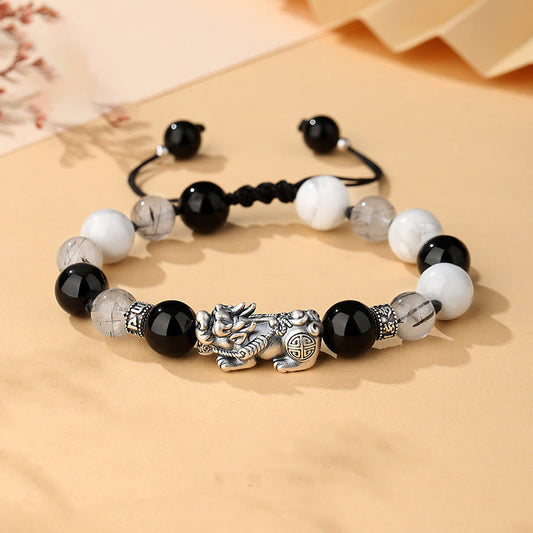 Black Obsidian Pi Xiu Bracelet – Front flat lay with obsidian, white turquoise, rutilated quartz beads, silver Pi Xiu charm, feng shui wealth