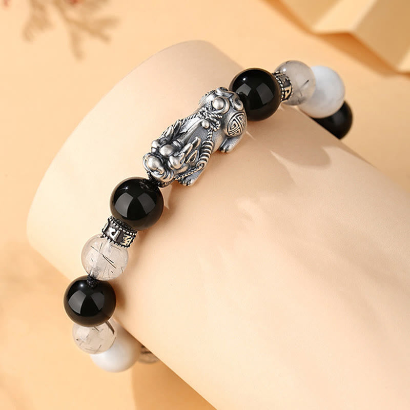 Black Obsidian Pi Xiu Bracelet – On wrist display, silver Pi Xiu with black obsidian and clear quartz beads, protective jewelry