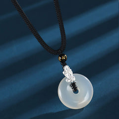 White Agate Peace Buckle Pi Xiu Silver Pendant – Single silver PiXiu white agate peace buckle on black cord close-up