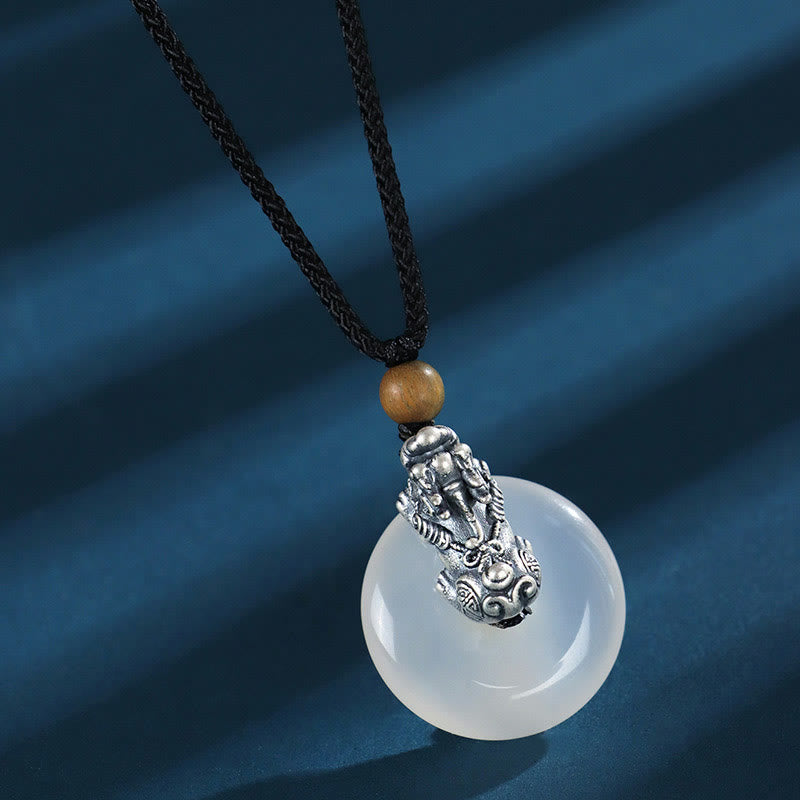 White Agate Peace Buckle Pi Xiu Silver Pendant – Silver PiXiu atop white agate disc with wooden bead braided necklace