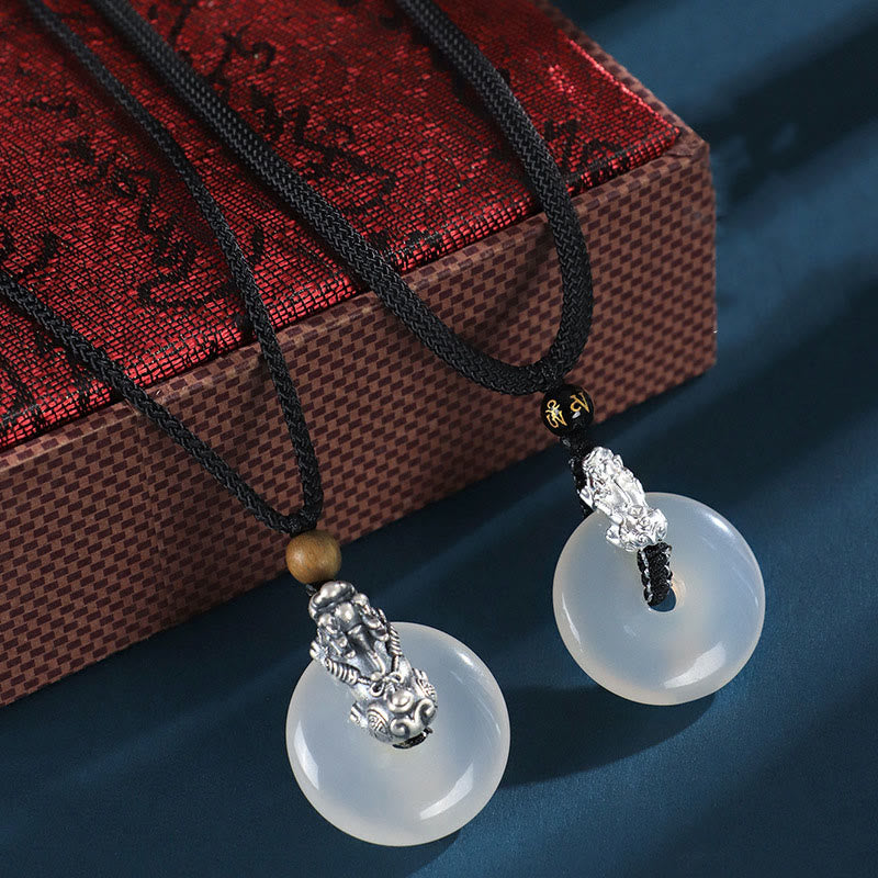 White Agate Peace Buckle Pi Xiu Silver Pendant – Pair of pendants on ornate red gift box premium packaging presentation