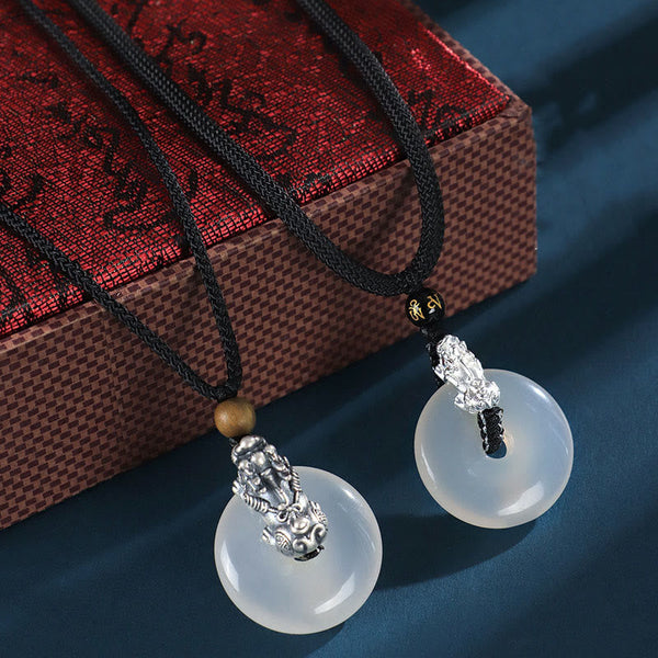 White Agate Peace Buckle Pi Xiu Silver Pendant – Pair of pendants on ornate red gift box premium packaging presentation