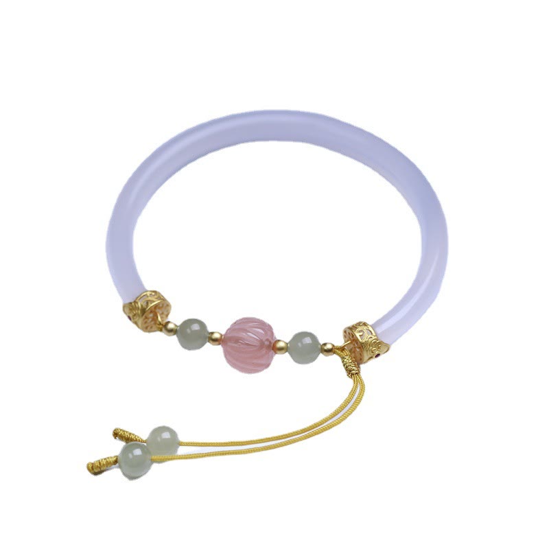 White Agate Lotus Hetian Jade Bracelet – full view of adjustable gold cord & jade bangle, elegant