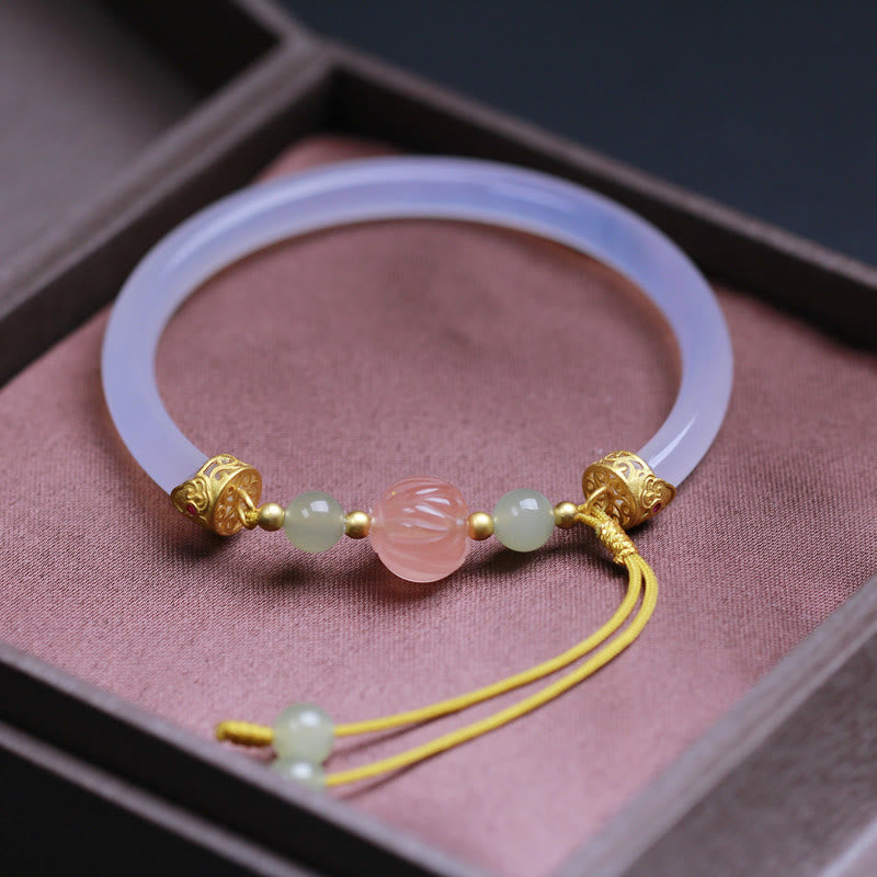 White Agate Lotus Hetian Jade Bracelet – carved pink lotus & jade beads on white bangle in rose velvet box, serene