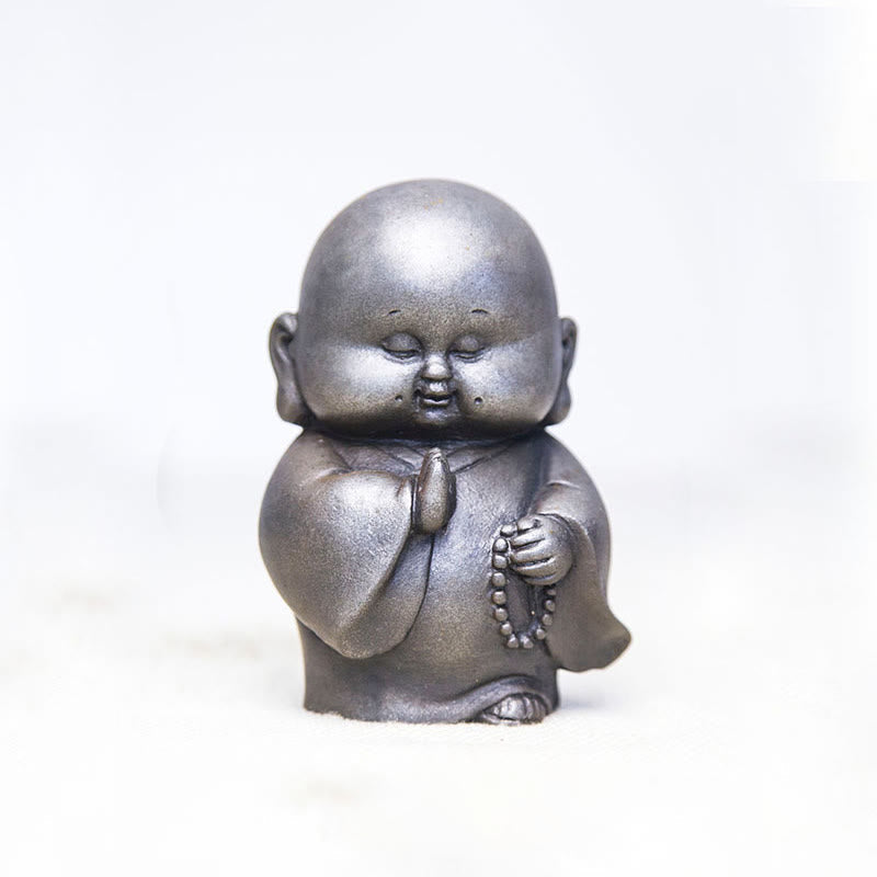 Little Monk Iron Powder Resin Statue – holding lotus flower pose, purity and enlightenment symbol