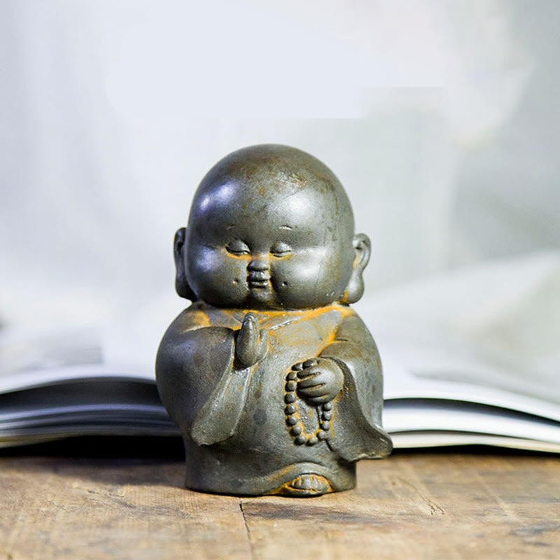 Little Monk Iron Powder Resin Statue – joyful face detail, closed eyes and gentle grin expression