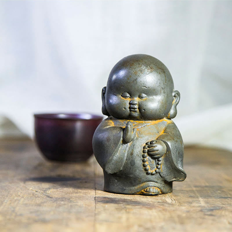 Little Monk Iron Powder Resin Statue – seated posture on lotus cushion, balanced meditation pose