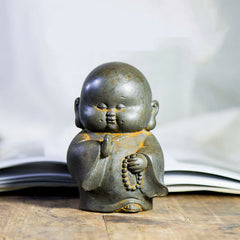 Little Monk Iron Powder Resin Statue – joyful face detail, closed eyes and gentle grin expression