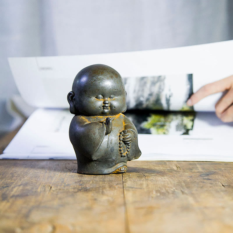 Little Monk Iron Powder Resin Statue – rust effect close-up, speckled iron powder on brown resin