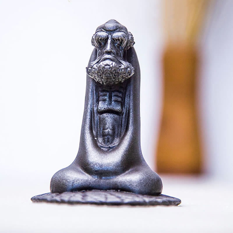 Bodhidharma Iron Powder Resin Statue – rust color variations under different lighting, warm tone