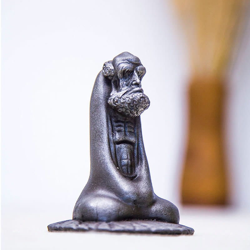 Bodhidharma Iron Powder Resin Statue – in living room bookshelf arrangement, modern Zen interior
