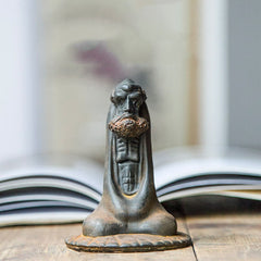 Bodhidharma Iron Powder Resin Statue – face detail with intense gaze, thick eyebrows and beard texture