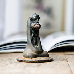 Bodhidharma Iron Powder Resin Statue – robe folds detail, cascading fabric in iron powder patina