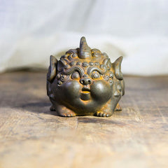 Handmade PiXiu Iron Powder Rust Cast Resin Wealth Statue – Front view of rusted PiXiu on rustic wood surface antique decor