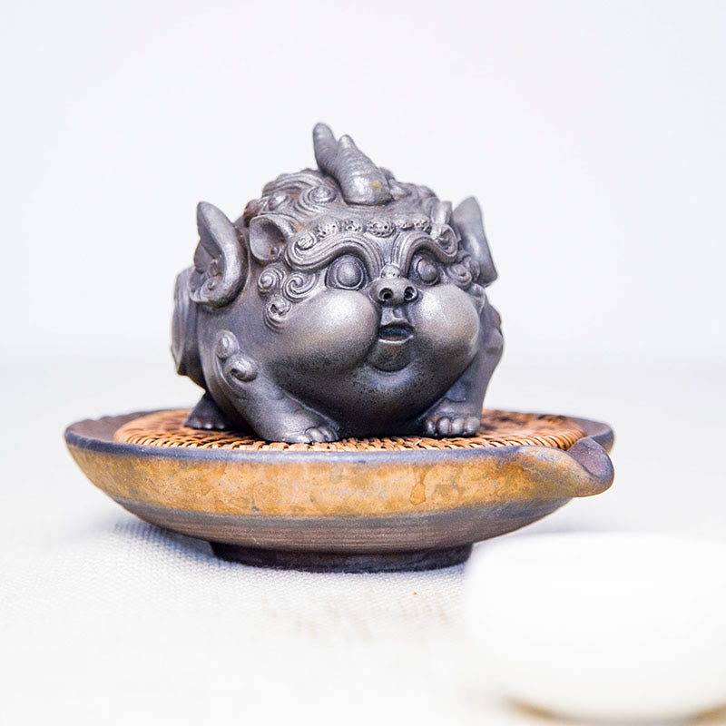 Handmade PiXiu Iron Powder Rust Cast Resin Wealth Statue – Silver PiXiu on ceramic tea plate, minimalist zen tea display