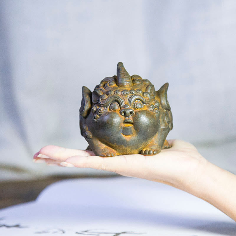 Handmade PiXiu Iron Powder Rust Cast Resin Wealth Statue – Hand palm holding rusted PiXiu statue showing compact size