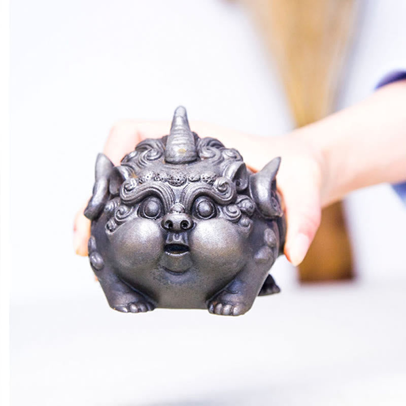 Handmade PiXiu Iron Powder Rust Cast Resin Wealth Statue – Two hands holding silver PiXiu front view bright white background
