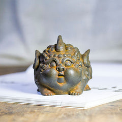 Handmade PiXiu Iron Powder Rust Cast Resin Wealth Statue – Front view of rusted iron powder cast PiXiu on wooden table