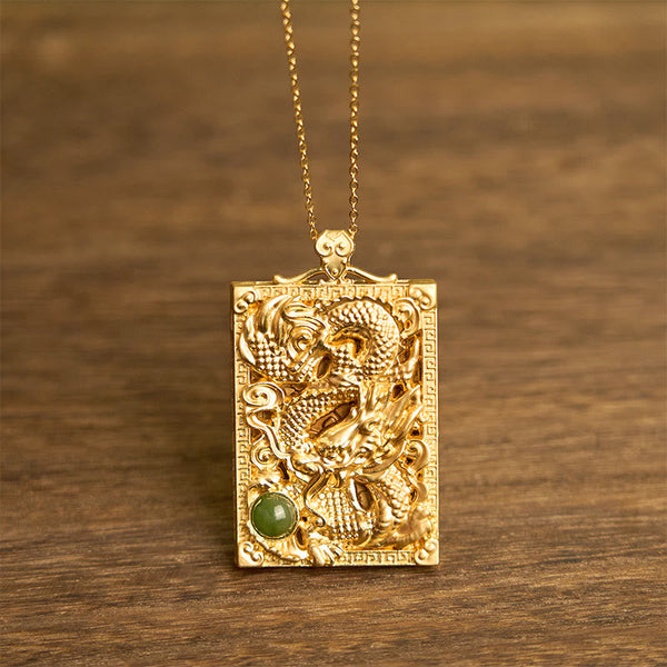 Dragon Hetian Jade Necklace | Strength – gold dragon relief pendant with green jade cabochon on wood, bold