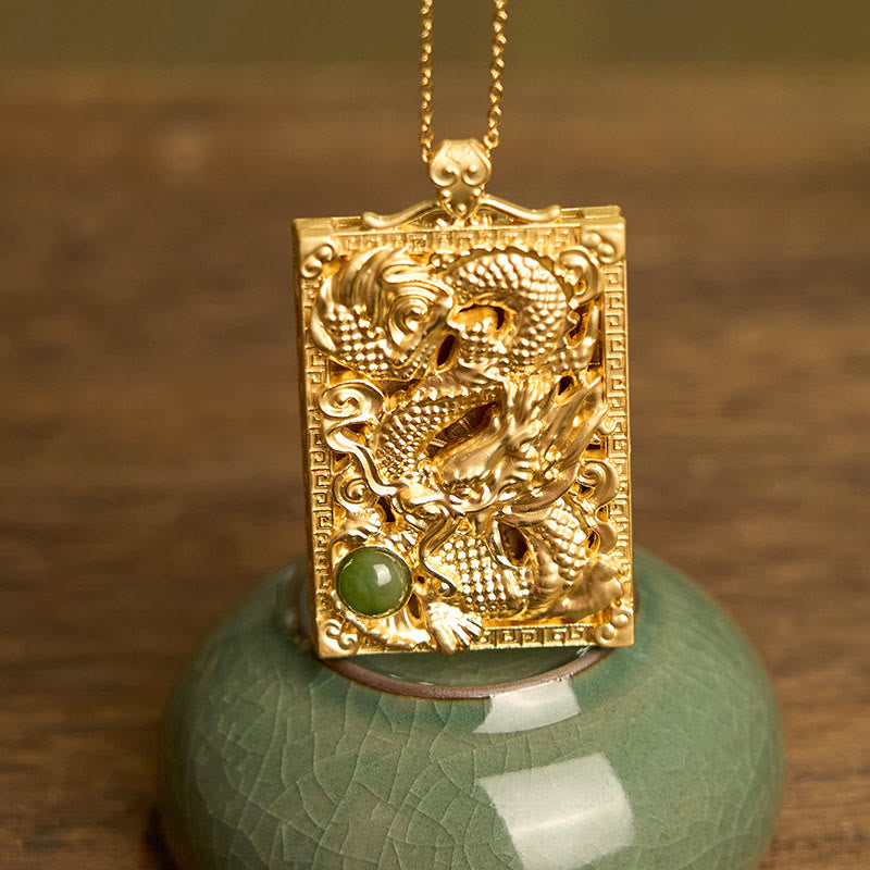 Dragon Hetian Jade Necklace | Strength – dragon pendant on celadon ceramic stand, intricate