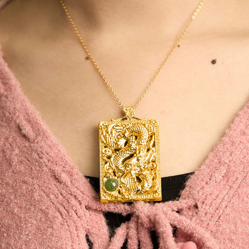 Dragon Hetian Jade Necklace | Strength – dragon pendant worn on model with pink knit, powerful