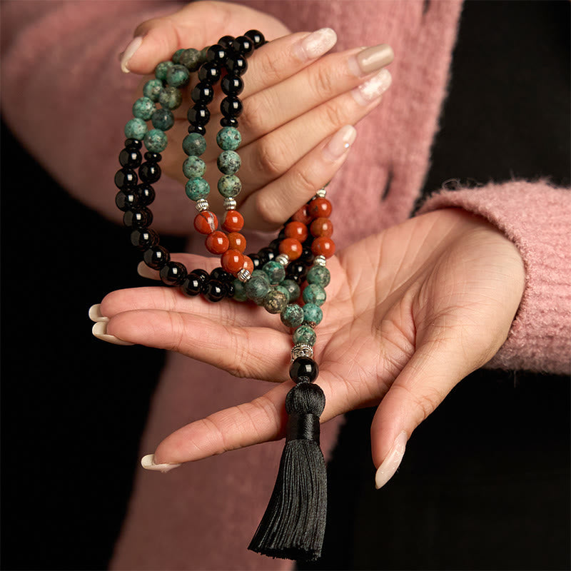 108 Mala Black Onyx Red Jasper Turquoise Bracelet – Close-up of black onyx beads, glossy deep black