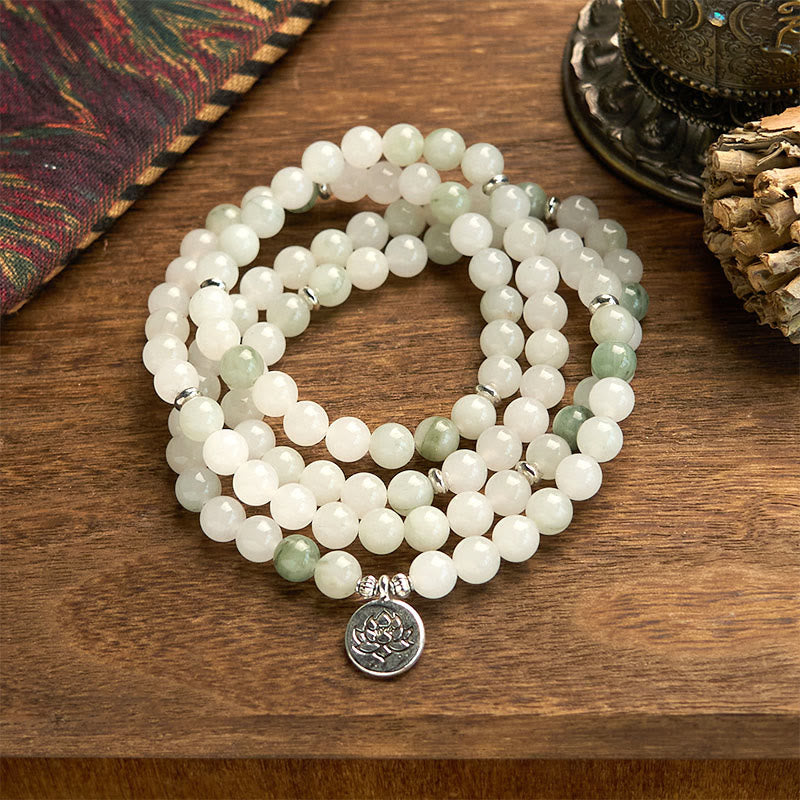 108 Mala Tianshan Jade Lotus Bracelet - triple-strand jade coils on wood with ethnic textile, spiritual