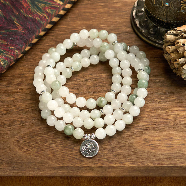 108 Mala Tianshan Jade Lotus Bracelet - triple-strand jade coils on wood with ethnic textile, spiritual
