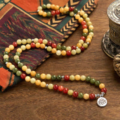 108 Mala Topaz Jasper Lotus Bracelet - flowing serpentine drape with textile and metal vessel, artisanal