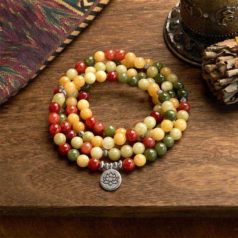 108 Mala Topaz Jasper Lotus Bracelet - coiled on aged wood with ethnic textile, lotus pendant, mindful