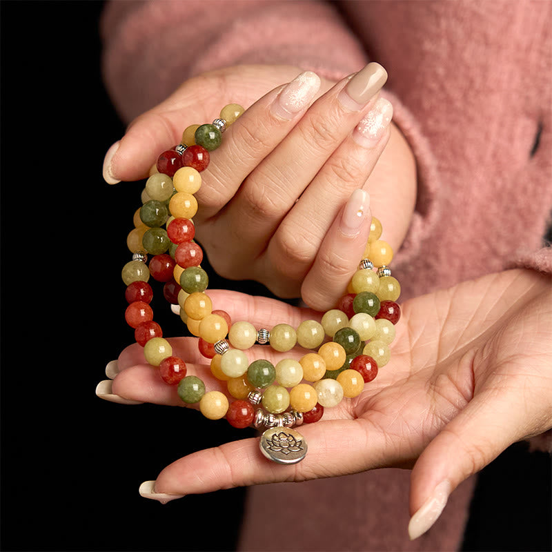108 Mala Topaz Jasper Lotus Bracelet - cradled in both hands, lotus pendant focal, intimate detail